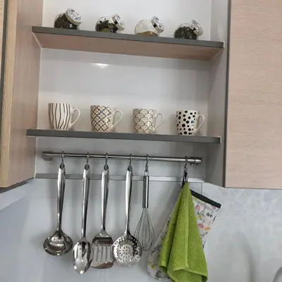 a group of utensils hanging on a wall at Calendula in Burgas City
