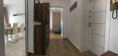 a hallway leading to a kitchen and a dining room at Calendula in Burgas City