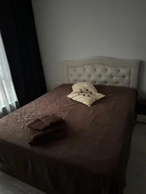 a bed with a blanket and two pillows on it at 