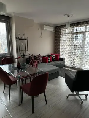 a living room with a couch and a glass table at 