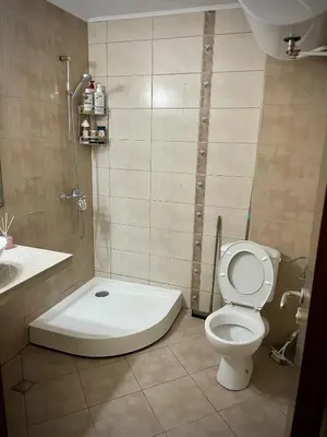 a bathroom with a toilet and a shower at Elegant Studio near Beach - Terrace & Parking in Nesebar