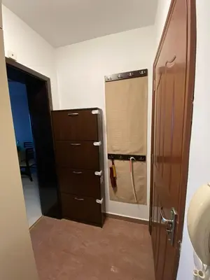 a bathroom with a sink and a closet with a mirror at Beautiful family appartment with sea view in Byala