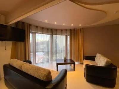 a living room with two couches and a large window at Beautiful family appartment with sea view in Byala