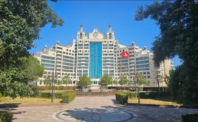 a large white building with a red chinese at Sunset C8-10 Pomorie in Pomorie