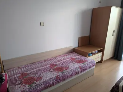 a small bedroom with a bed and a dresser at Sunny Day 5 in Tŭnkovo