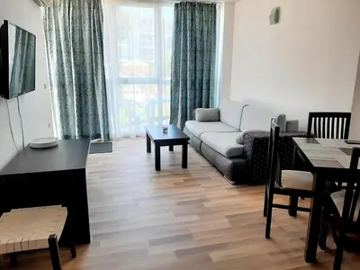 a living room with a couch and a table at Atlantis 8016 in Burgas City