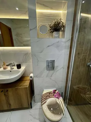 a bathroom with a toilet and a sink at 1BD Apartment next to the Sea Garden by Flat Mаnager in Burgas City