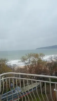 a view of the beach from a balcony with a railing at Varna in Varna City