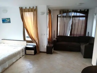 a living room with a couch and a bed at Oasis Resort&Spa Lozenets Studio 2 in Lozenets