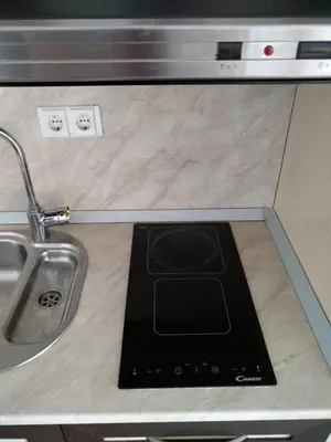 a kitchen counter with a sink and a tablet on it at Oasis Resort&Spa Lozenets Studio 2 in Lozenets