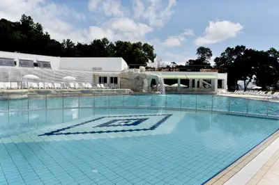 a large swimming pool in front of a building at Villas Ropotamo Maisonette in Primorsko