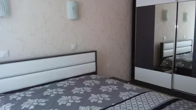 a bedroom with a bed and a mirror at Villa Roma Monna in Nesebar