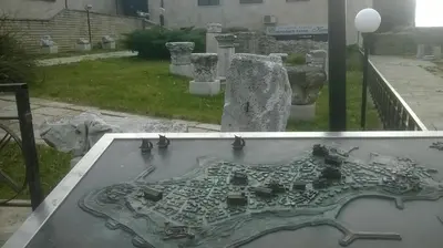 a metal map on a table in a cemetery at Villa Roma Monna in Nesebar