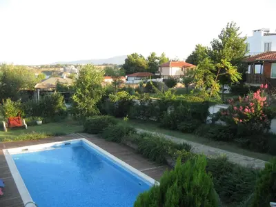 a swimming pool in the yard of a house at Villa Magnet in Lozenets