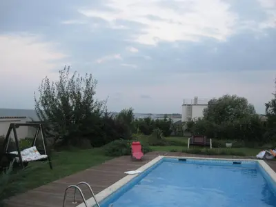 a swimming pool in the backyard of a house at Villa Magnet in Lozenets
