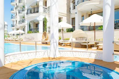 a pool at a hotel with a swimming pool at Harmony Suites Saint Vlas in Sveti Vlas