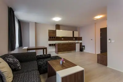 a living room with a couch and a table at Hotel Provadia in Provadiya