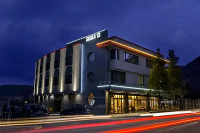 a building with cars parked in front of it at Hotel Provadia in Provadiya