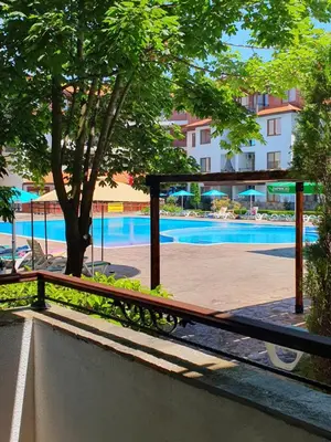 a view of the swimming pool from the balcony of a hotel at Family hotel Apolon in Nesebar