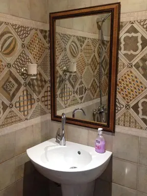 a bathroom with a sink and a mirror at Guest Rooms Maria Luiza in Varna City