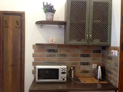 a microwave on a counter in a kitchen at Guest Rooms Maria Luiza in Varna City