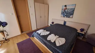 a bedroom with a bed with bows on it at Aquaria Holiday Apartments in Sunny Beach