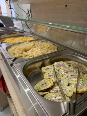 a buffet line with several trays of food on display at Melia Mar in Sozopol
