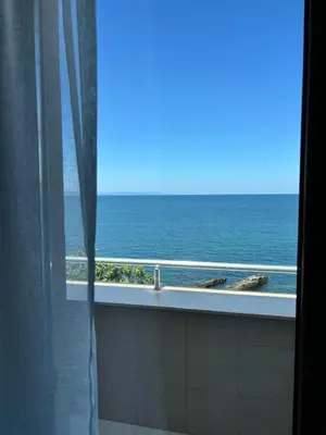 a view of the ocean from a bathroom window at Melia Mar in Sozopol