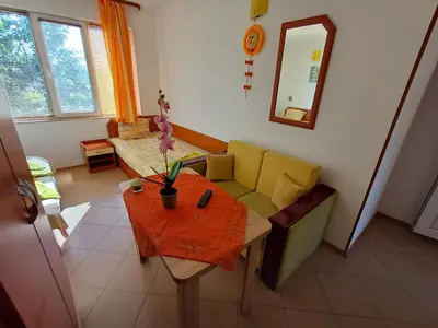 a living room with a couch and a table at Dom Zaharievi in Byala