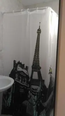 a bathroom with a picture of the eiffel tower at Studio Nera in Pomorie