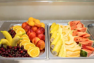 two trays of different types of fruits and vegetables at Aparthotel Paradiso in Nesebar