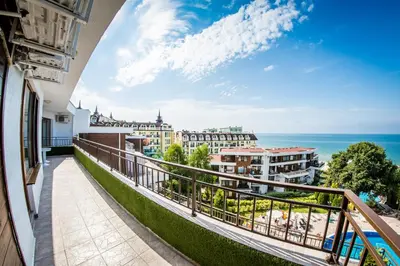 a balcony with a view of the ocean at Messambria Fort Noks Beach Apartments in Elenite