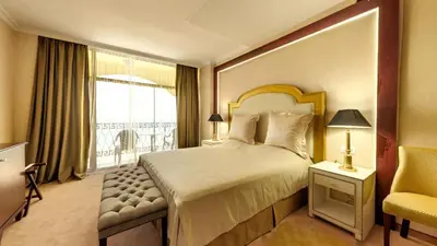 a hotel room with a bed and a window at Imperial Palace Hotel in Sunny Beach
