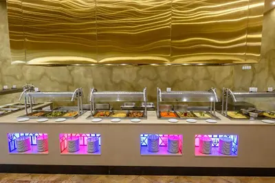 a buffet line with many different types of food at Imperial Palace Hotel in Sunny Beach