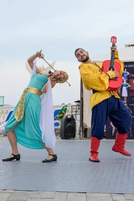 a couple of people in costume performing a performance at Imperial Palace Hotel in Sunny Beach