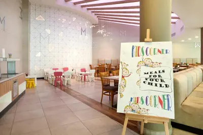 a restaurant with a sign that reads autism waits for your child at Hotel Marvel All Inclusive - FULLY RENOVATED FREE Beach Access in Sunny Beach