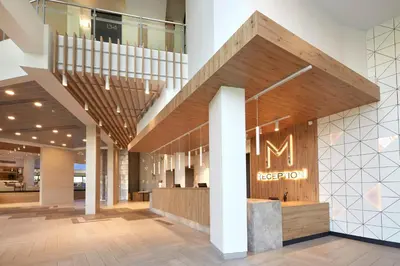 a lobby with a staircase and a sign that reads reception at Hotel Marvel All Inclusive - FULLY RENOVATED FREE Beach Access in Sunny Beach