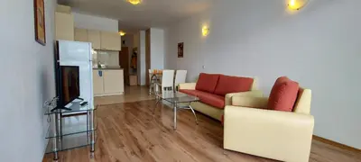 a living room with a couch and a table at Julia Family Apartments in Sunny Beach