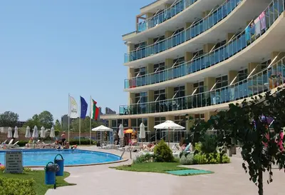 a hotel with a swimming pool and a resort at Julia Family Apartments in Sunny Beach