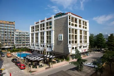 a large white building with a pool in front of it at Art Hotel Babylon in Sunny Beach