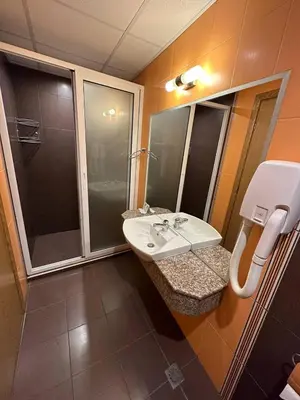 a bathroom with a sink and a shower at Briz Beach apartments - section B in Sunny Beach