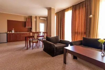 a living room with a couch and a table at Festa Pomorie Resort in Pomorie