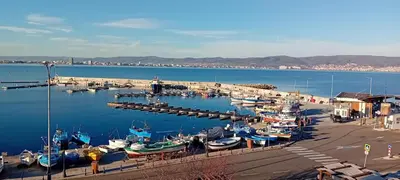 a group of boats docked at a dock in the water at Stankoff Hotel in Nesebar