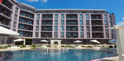 a large building with a swimming pool in front of it at Hotel Rainbow 3 Resort Club in Sunny Beach