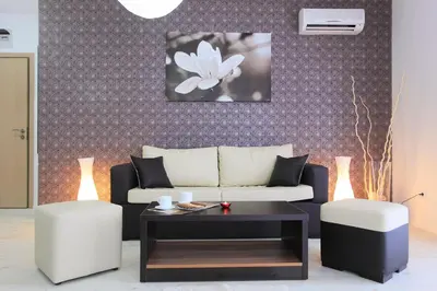 a living room with a couch and a table at Hotel Rainbow 3 Resort Club in Sunny Beach