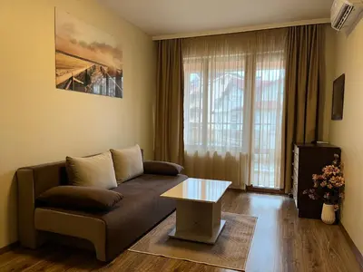 a living room with a couch and a table at Hotel Silver in Sozopol