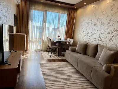 a living room with a couch and a table at Hotel Silver in Sozopol