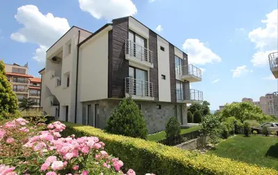 a building with pink flowers in front of it at The chill House in Sunny Beach in Sunny Beach