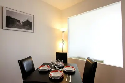 a dining room table with wine glasses on it at The chill House in Sunny Beach in Sunny Beach