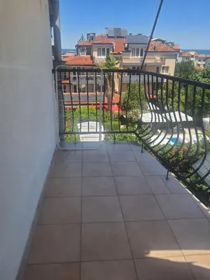 a balcony with a railing and a view of a yard at Apartments Ivelin in Lozenets